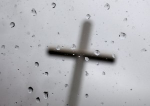 Image of the cross behind the glass